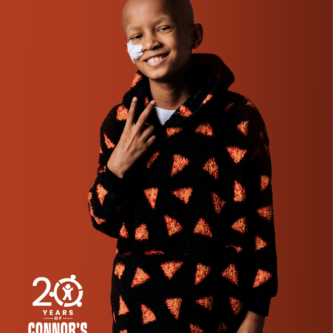 boy wearing pjs decorated with pizzas