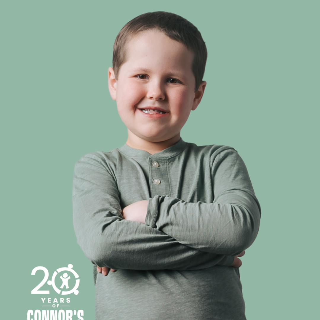 boy posing with his arms crossed